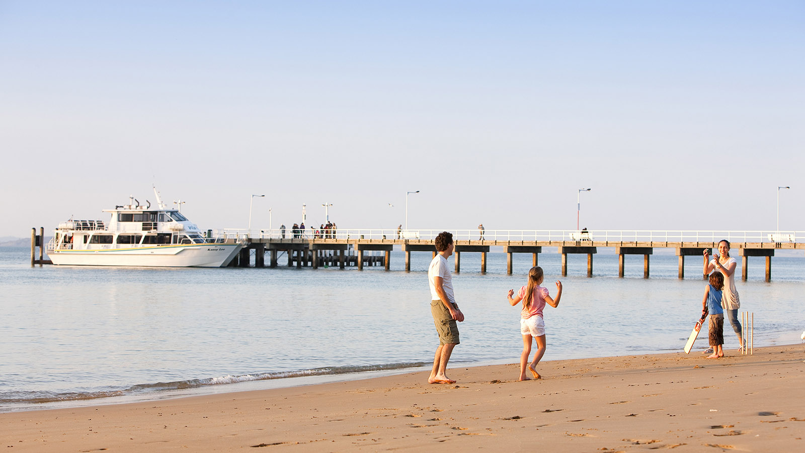 Family on Cowes foreshore, Phillip Island, Victoria, Australia